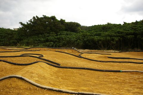 1986 Ford Bronco - An outdoor track for remote-controlled cars winds through a dirt landscape.