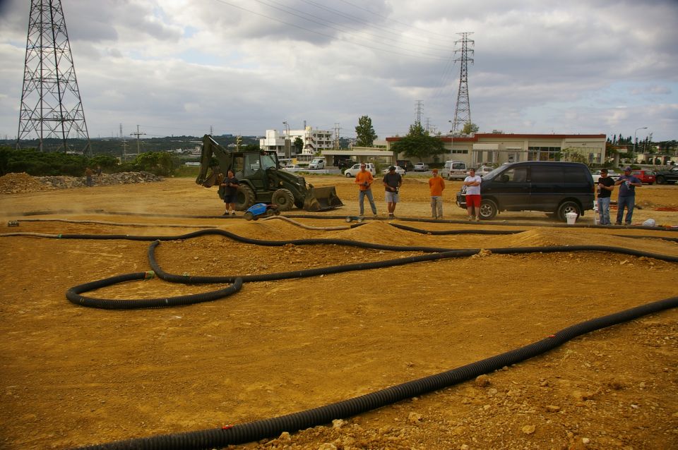 RC track with backhoe and black van