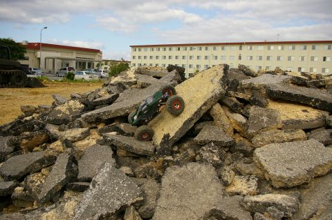 1986 Ford Bronco - A remote control car navigates a challenging terrain of debris.
