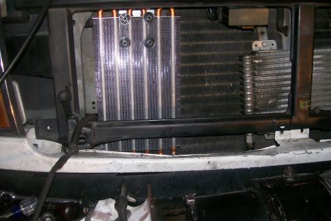 1992 Ford C-350 (Centurion Conversions) - Close-up view of the radiator and AC condenser assembly, likely from a truck or large van.