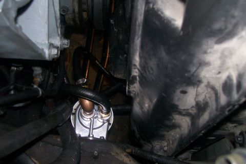 1992 Ford C-350 (Centurion Conversions) - Engine bay fuel filter assembly with connected hoses.