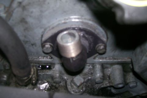 1992 Ford C-350 (Centurion Conversions) - Close-up of an engine component, possibly a water outlet or sensor housing.