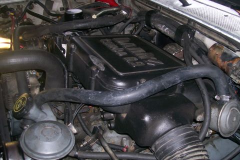 1992 Ford C-350 (Centurion Conversions) - Close-up of the engine bay, the black "DIESEL 7.3" valve cover.