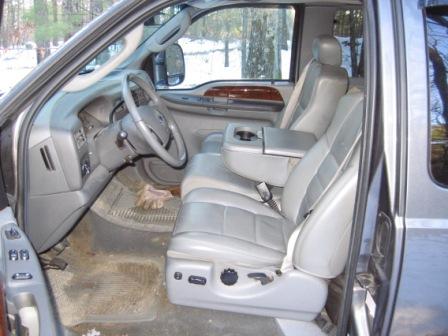 2003 Ford F-350 - Interior view of a 2003 Ford F-350, its gray leather seats and dashboard.