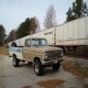1967 Ford F-250 - This 1967 Ford F-250 pickup truck is seen in a 3q-front view, parked beside a long train car.