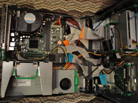 1993 Ford Taurus - Internal view of a desktop computer's components, showing motherboard, wiring, and drives.