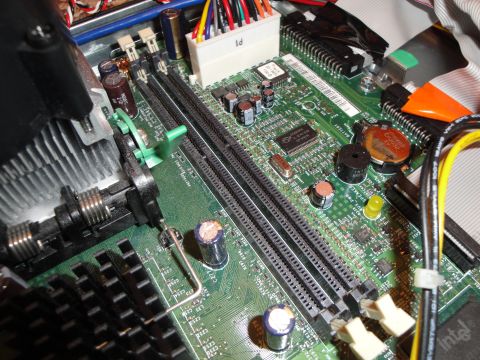 1993 Ford Taurus - Close-up view of a computer motherboard, highlighting the RAM slots and heatsink assembly.