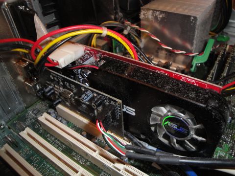 1993 Ford Taurus - Internal view of a computer's graphics card and motherboard, showing dust accumulation on components.