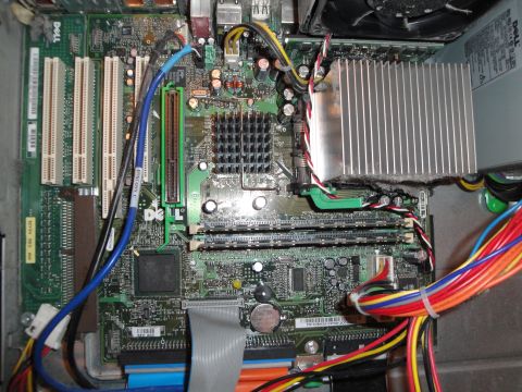 1993 Ford Taurus - Close-up view of a computer's internal motherboard, showing components like RAM slots and heatsinks.