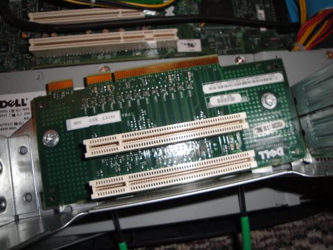 1993 Ford Taurus - Computer motherboard with expansion slots and a Dell branded card installed.
