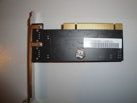 1993 Ford Taurus - A computer expansion card, possibly for storage or networking, is shown with its internal circuitry and external connectors visible.