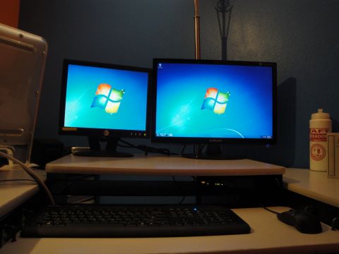 1993 Ford Taurus - A dual-monitor computer setup with a keyboard and mouse is visible on a desk.