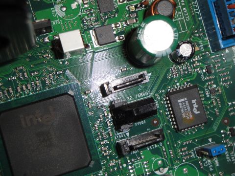 1993 Ford Taurus - Motherboard detail with Intel chips and various connectors visible.