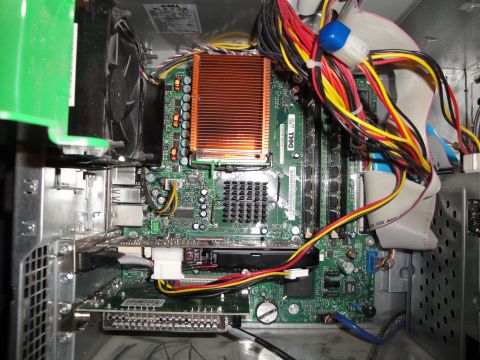 1993 Ford Taurus - Internal view of a computer system showing the motherboard, CPU heatsink, fan, and various cables.