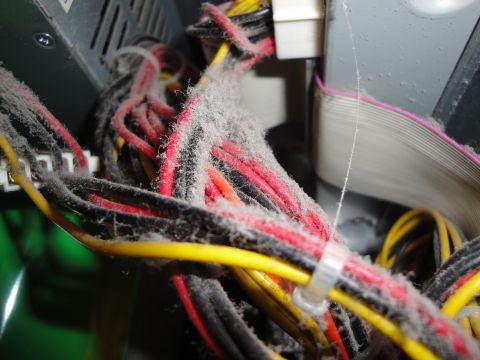 1993 Ford Taurus - Close-up of a computer's internal wiring covered in a thick layer of dust.