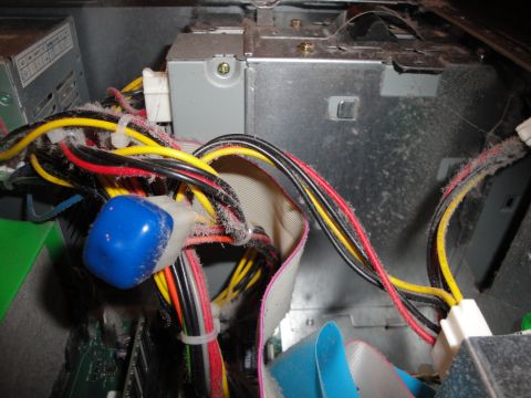 1993 Ford Taurus - Dust accumulation on computer components, including the power supply and wiring harness.