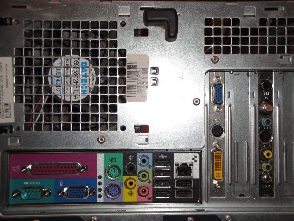 Rear panel of a computer tower showing fan, ports, and labels