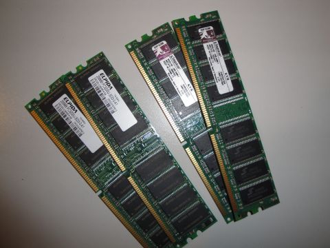 1993 Ford Taurus - Computer RAM modules, including Elpida and Kingston brands, are laid out on a surface.