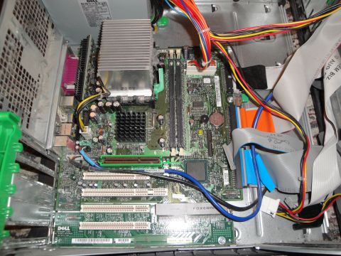 1993 Ford Taurus - Internal components of a Dell desktop computer, including the motherboard, RAM slots, and various power and data cables.