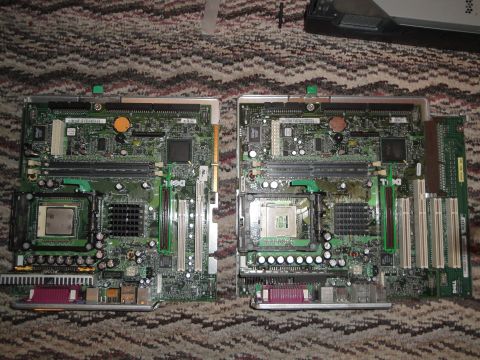 1993 Ford Taurus - Two computer motherboards, likely from Dell systems, are shown side-by-side.