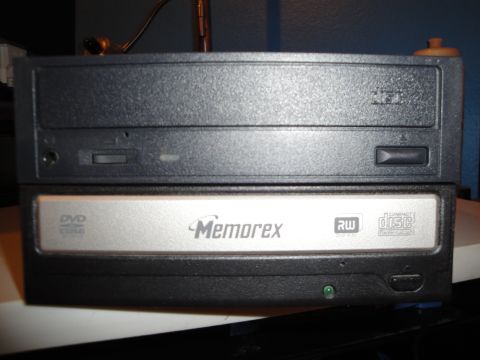 1993 Ford Taurus - A close-up view of two stacked computer optical drives, one labeled Memorex.