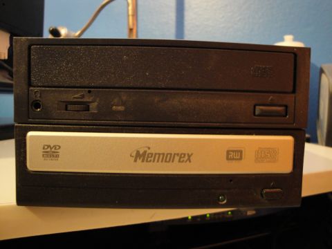 1993 Ford Taurus - Two computer optical drives are stacked, with a Memorex DVD RW drive on top of a black drive.