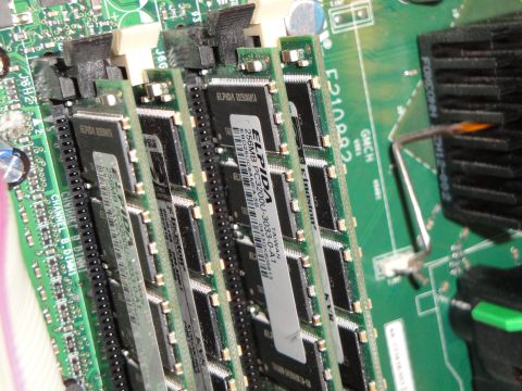 1993 Ford Taurus - Close-up view of computer RAM modules installed on a green motherboard, showing electronic components and labels.
