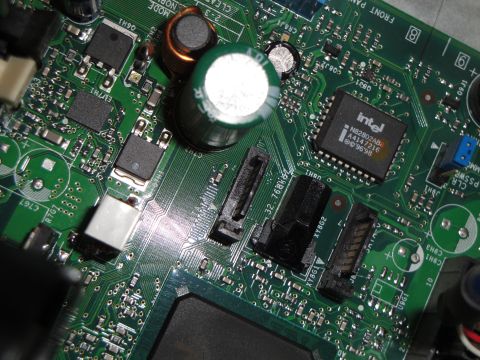 1993 Ford Taurus - A detailed view of a computer motherboard, highlighting an Intel processor and various electronic components.