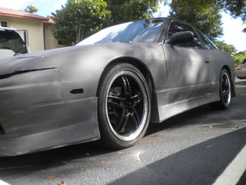 1991 Nissan 240SX - This Nissan 240SX coupe has a matte gray finish and aftermarket wheels.