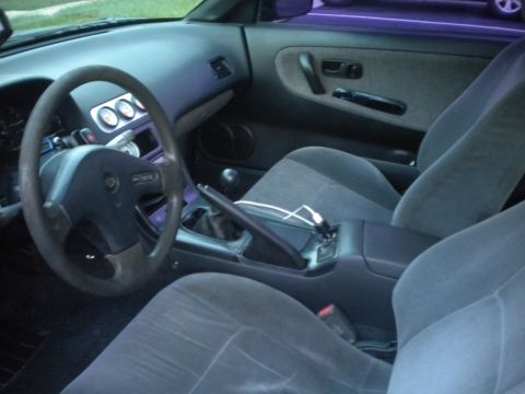 1991 Nissan 240SX - Interior of a 1991 Nissan 240SX, aftermarket gauges and a manual transmission.