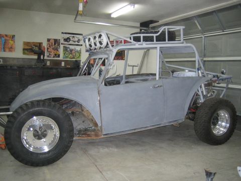 1996 Ford Bronco - A custom-built off-road buggy is shown in a garage, appearing to be under construction.