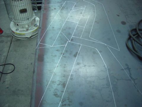 1993 Ford Bronco - Metal sheet with chalk lines drawn on it, possibly for cutting. A heater is to the left.