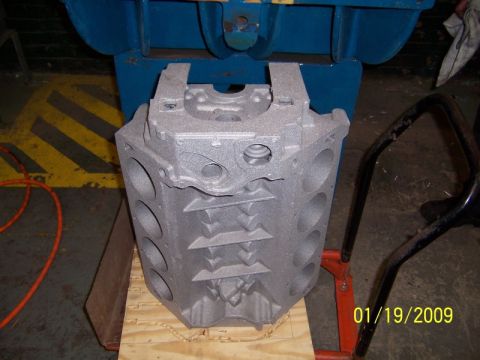 1972 Ford Ranchero - Aluminum engine block sits on a wooden pallet, with industrial equipment visible.