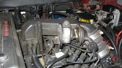 1997 Dodge 2500 - Close-up of engine components, including intake manifold and wiring harness.