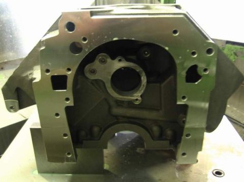 1972 Ford Ranchero - Head-on view of the bellhousing face of a freshly machined V8 engine block, showing the rear main seal bore, the tapped bellhousing bolt pa…
