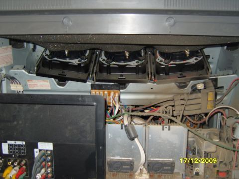 1989 Ford Bronco - Internal components of a disassembled television, including speakers and complex wiring. Date stamp visible.