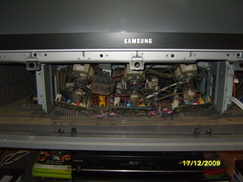 1989 Ford Bronco - The internal components of a Samsung television are exposed, revealing a complex arrangement of electronics.