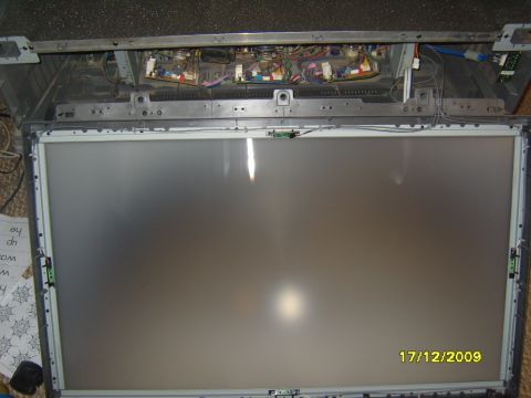1989 Ford Bronco - Internal components of a disassembled television are shown, with the screen and circuit boards exposed.