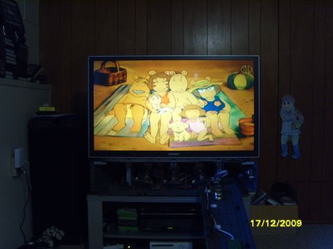 1989 Ford Bronco - A television displays a cartoon scene, with a date stamp visible in the lower right corner.