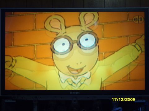 1989 Ford Bronco - A television displays an animated aardvark character from the show Arthur.