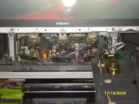 1989 Ford Bronco - Internal components of a Samsung TV, with VCR and DVD player visible underneath.
