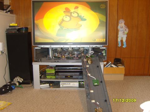 1989 Ford Bronco - A television is disassembled, revealing its internal components, with a cartoon playing on the screen.
