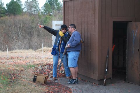 1979 Ford F-150 - Men at a shooting range with shotguns, one giving instructions.