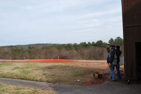 1979 Ford F-150 - Clay pigeon shooting event with participants taking aim at targets.