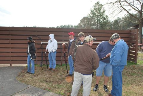 1979 Ford F-150 - People gathered at an outdoor shooting range with firearms.
