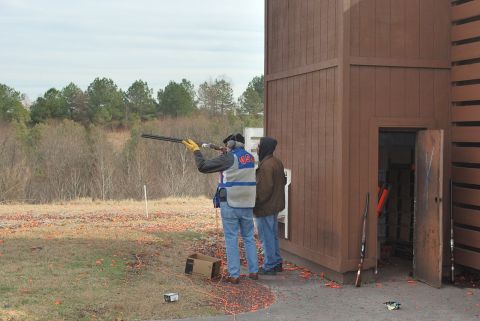 1979 Ford F-150 - Clay shooting event with participants and a shooting stand.