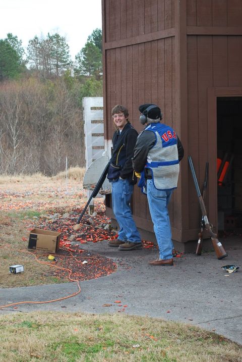 1979 Ford F-150 - Clay shooting event with two participants and shotguns visible.