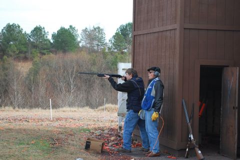 1979 Ford F-150 - A company outing on December 16, 2009, features two men participating in a clay pigeon shooting event.