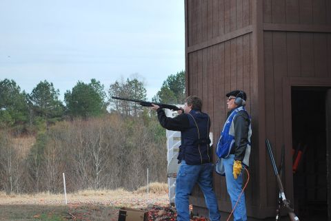 1979 Ford F-150 - Clay pigeon shooting event with participants and range facilities.