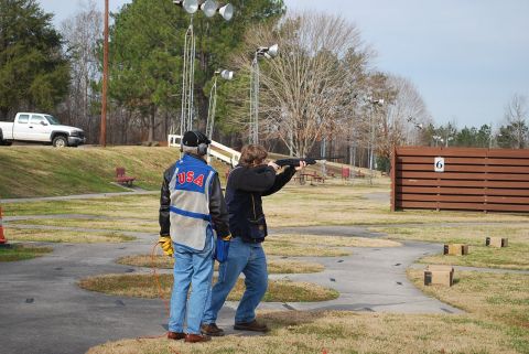 1979 Ford F-150 - A white pickup truck is visible in the background at a shooting range.